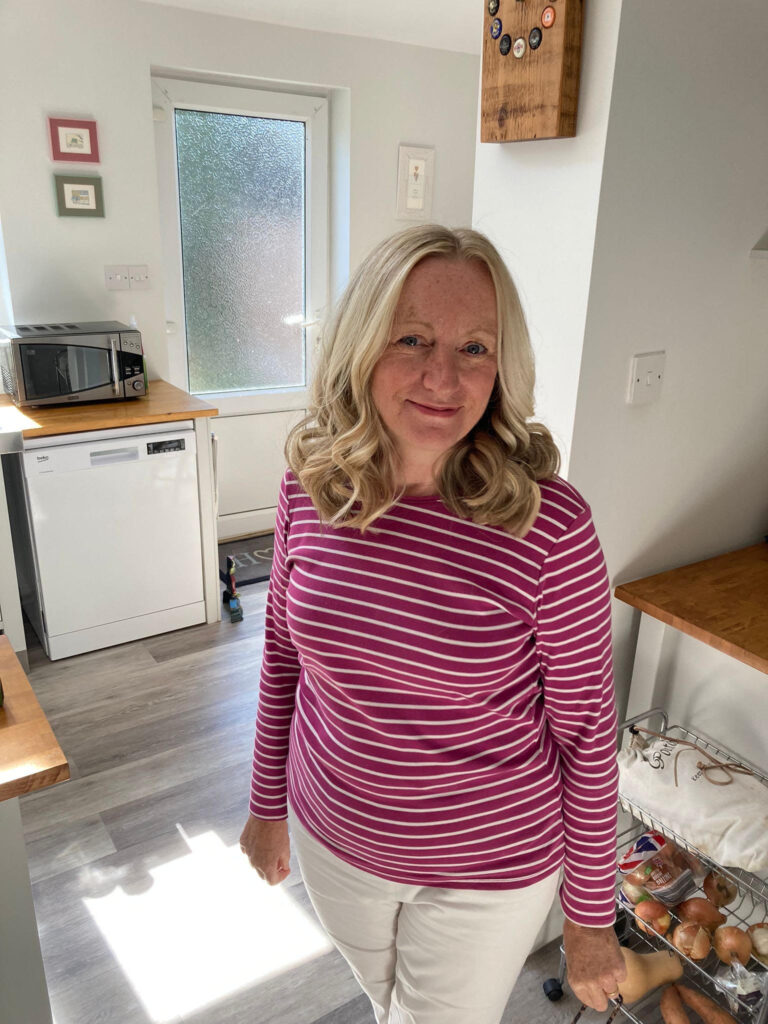 Philippa posing in her kitchen.